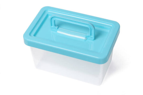 Empty plastic container with handle on white background